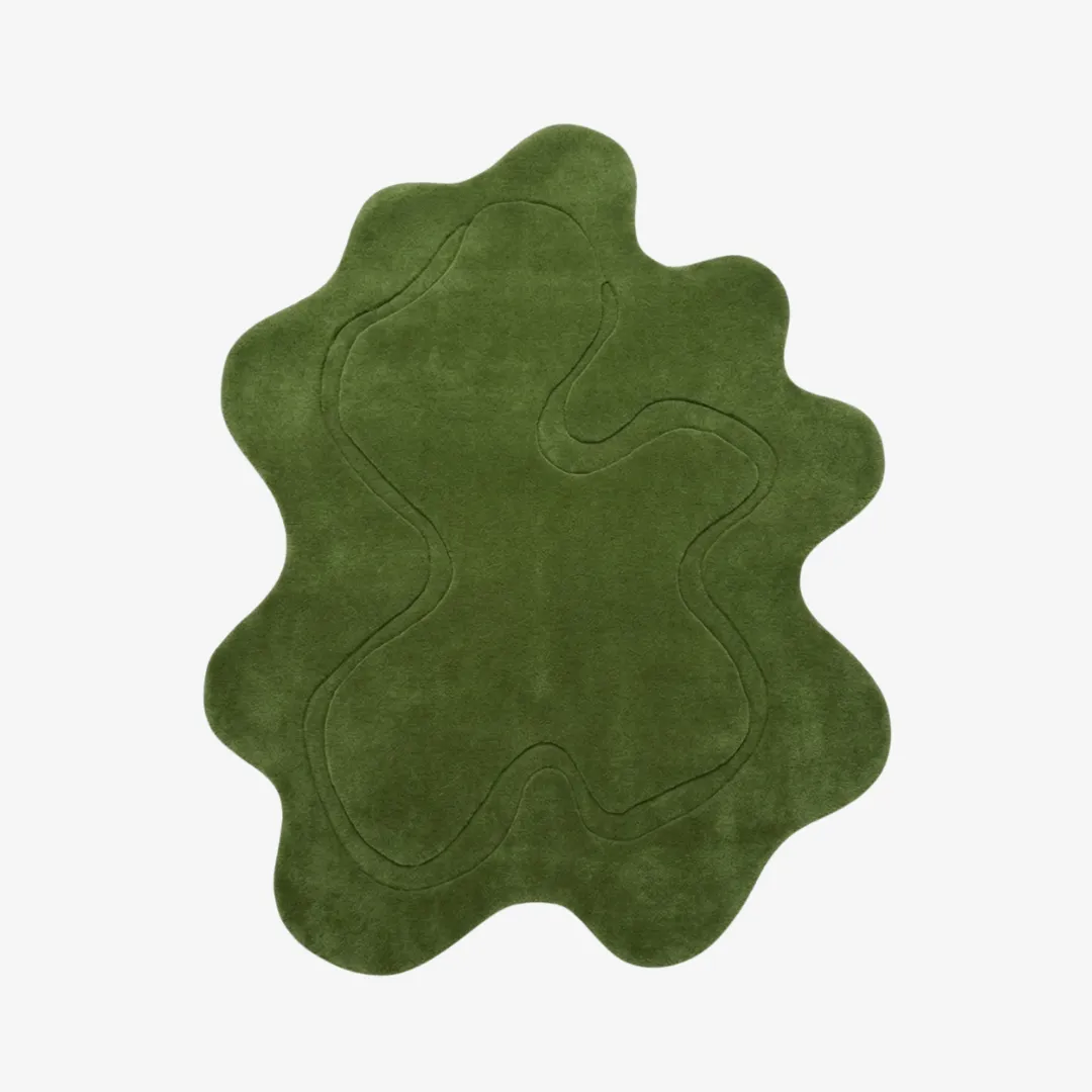 verdant forms rug top view Verdant Forms green organic irregular-shaped tufted area rug featuring carved abstract line details, displayed flat.