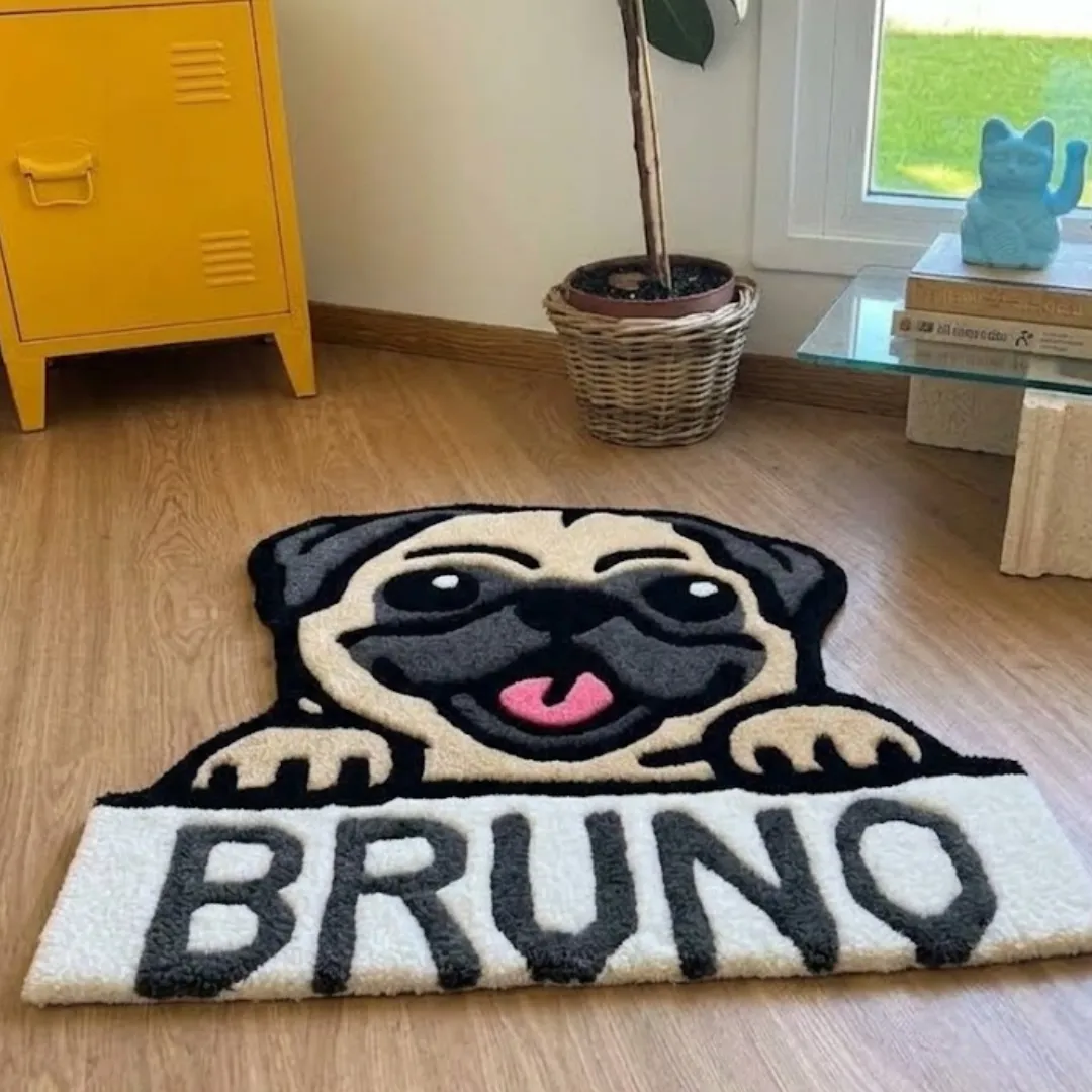 bruno pug rug angle interior view Close-up macro texture shot of the high-density tufted wool pile, carved contours, and textured lettering on the Bruno Pug designer rug.