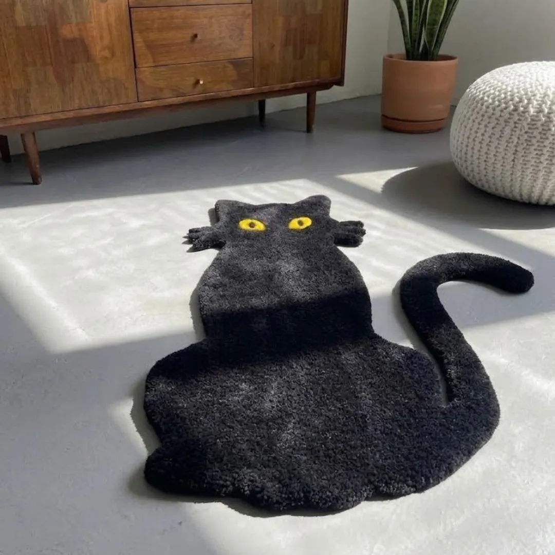 shadow meow rug angle view Angle view of the Shadow Meow tufted novelty rug showcasing its custom cat silhouette, curved tail, and plush wool pile.
